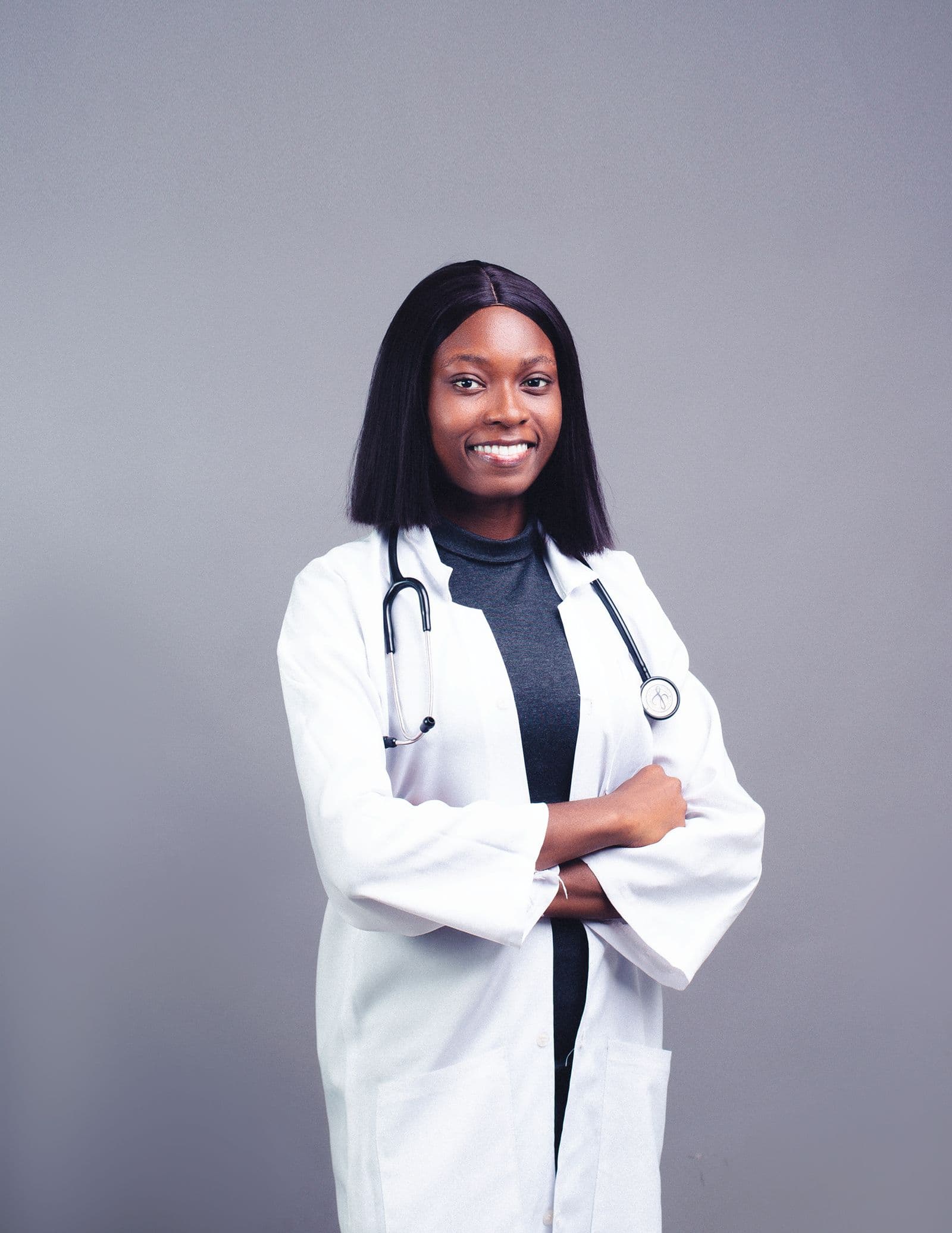 A smiling doctor in a white coat